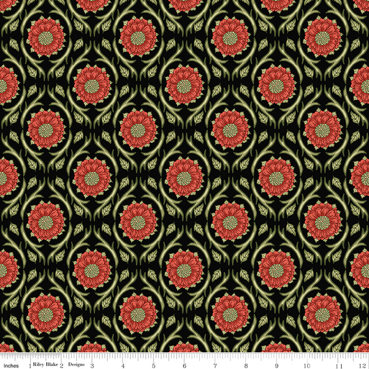 Black fabric with repeating red floral medallions and olive green vines with a ruler along the bottom for scale