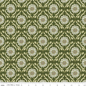 Hunter green fabric with repeating cream floral medallions and leafy vines with a ruler for scale at the bottom