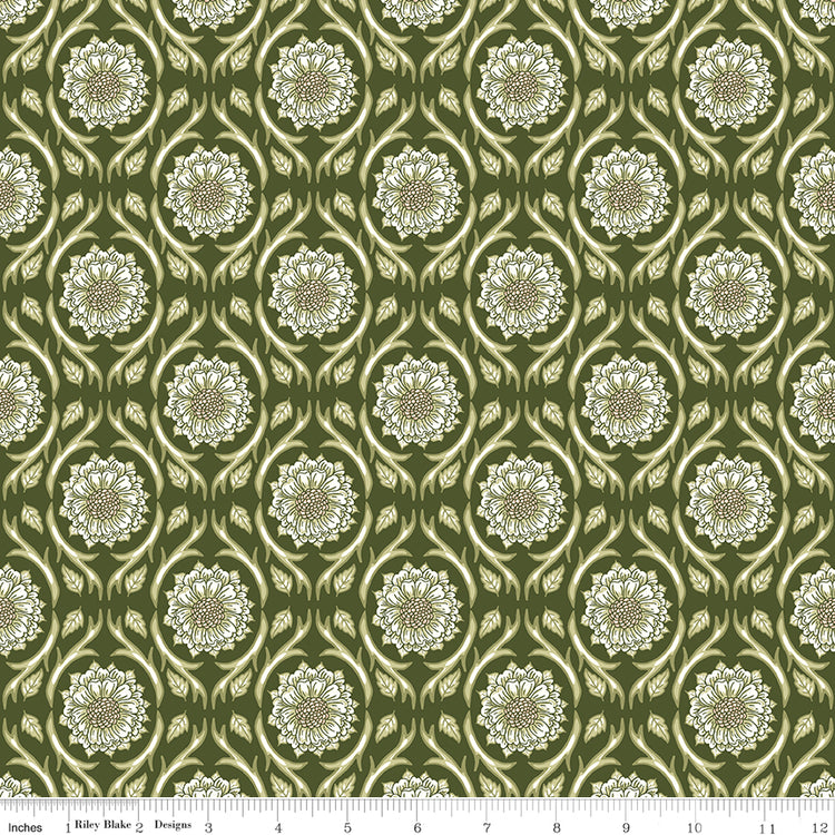 Hunter green fabric with repeating cream floral medallions and leafy vines with a ruler for scale at the bottom