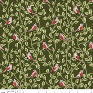 Hunter green fabric with red and cream birds among winding leafy branches and a ruler at the bottom for scale. 