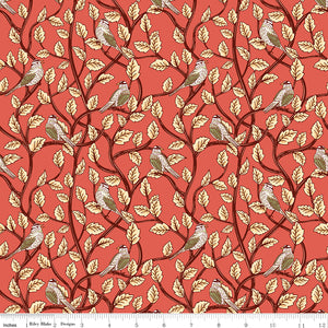 Sunset coral fabric with birds perched among cream leaves and dark winding branches with a ruler along the bottom for scale. 