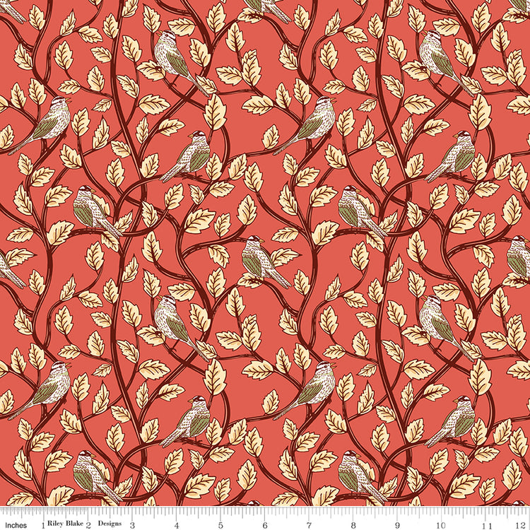 Sunset coral fabric with birds perched among cream leaves and dark winding branches with a ruler along the bottom for scale. 