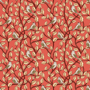 Sunset coral fabric with birds perched among cream leaves and dark winding branches
