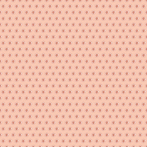Blush pink fabric with evenly spaced small cream and coral flowers