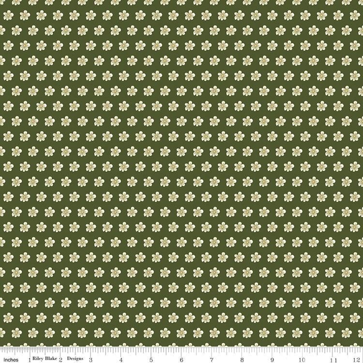 Hunter green fabric with evenly spaced small cream flowers and a ruler for scale