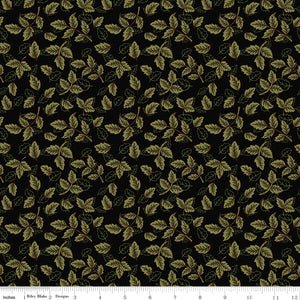 Black fabric with scattered olive green leafy sprigs and a ruler along the bottom for scale. 