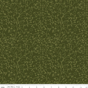 Hunter green fabric with subtle olive curling vines and tiny leaves with ruler for scale.