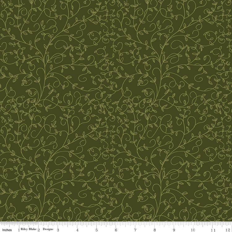 Hunter green fabric with subtle olive curling vines and tiny leaves with ruler for scale.