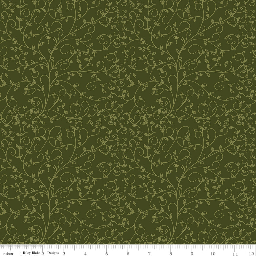 Hunter green fabric with subtle olive curling vines and tiny leaves with ruler for scale.