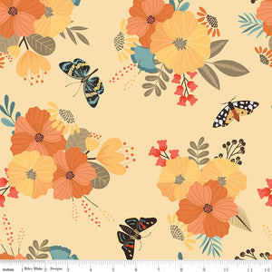 A repeating floral and butterfly pattern on a warm cream background, with large orange and yellow flowers, teal and olive leaves, and black, orange, and blue butterflies. A ruler for scale.
