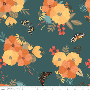 A repeating floral and butterfly pattern on a dark teal background, with large orange and yellow flowers, smaller red blossoms, and several butterflies. A white ruler along the bottom edge shows scale and includes the text 'Riley Blake Designs', indicating the brand.