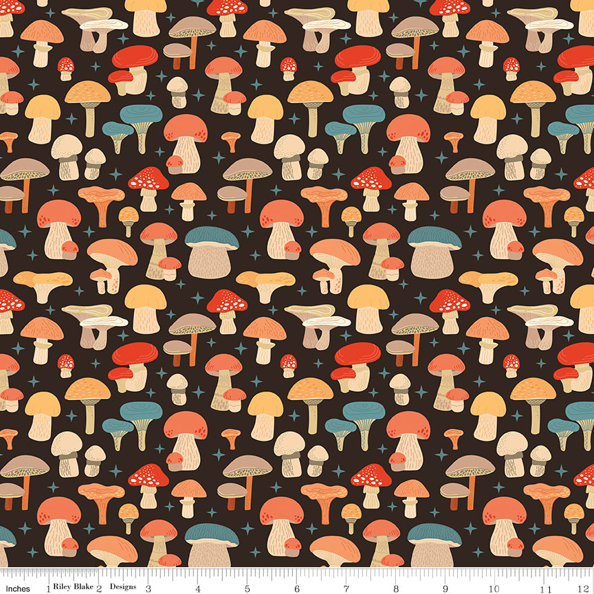 A repeating pattern of whimsical mushrooms in red, orange, beige, and teal on a dark brown background, with a small ruler along the bottom edge showing scale.