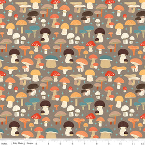 A repeating pattern of illustrated mushrooms in warm autumn colors on a taupe background, with a small ruler strip along the bottom edge showing scale.