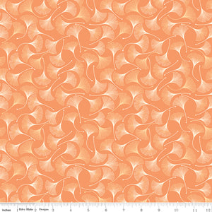 A repeating pattern of stylized ginkgo leaves in peach, orange, and cream, shown as a fabric or paper swatch with a ruler along the bottom for scale.
