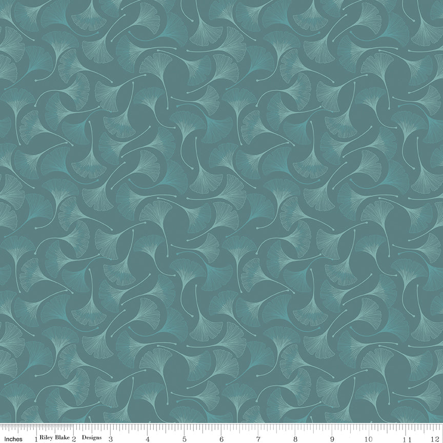 A repeating fabric pattern featuring stylized ginkgo leaves in muted teal and sage green tones, shown with a white ruler along the bottom edge for scale.
