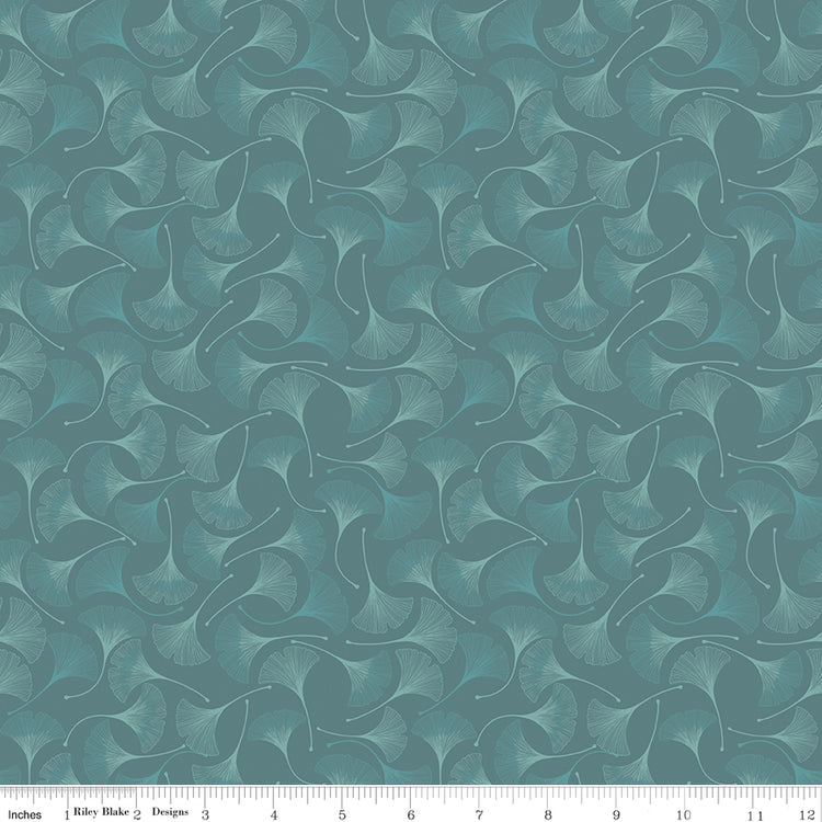 A repeating fabric pattern featuring stylized ginkgo leaves in muted teal and sage green tones, shown with a white ruler along the bottom edge for scale.