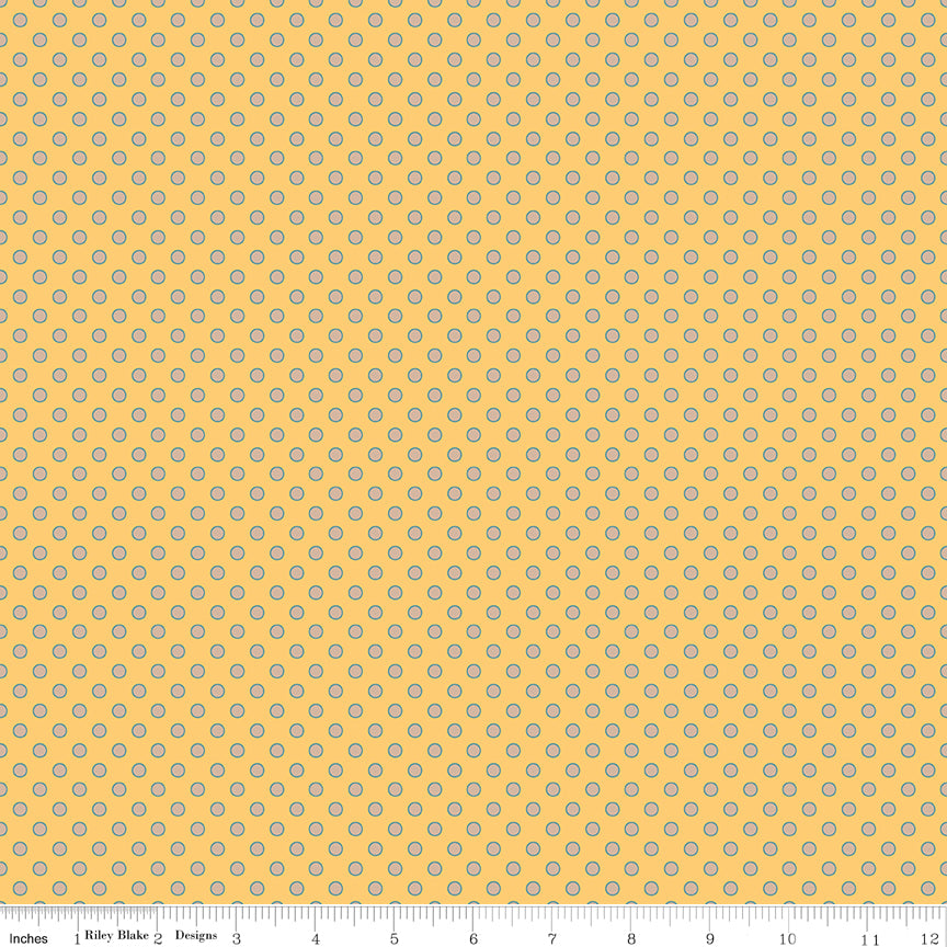 A repeating fabric pattern of small white floral clusters on a turquoise background, with a ruler along the bottom edge showing scale.