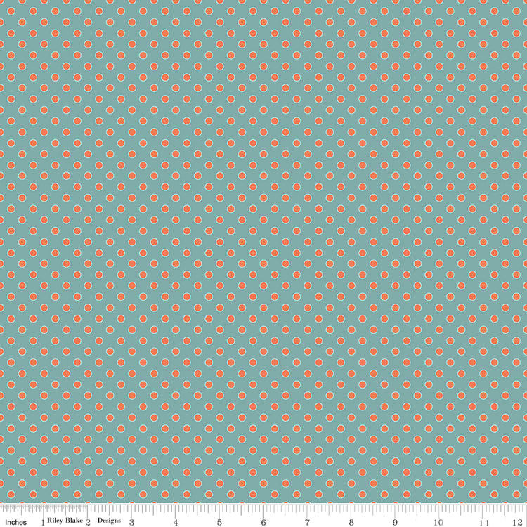 A repeating sage green and olive green ornamental pattern shown flat, with a small ruler along the bottom edge for scale.