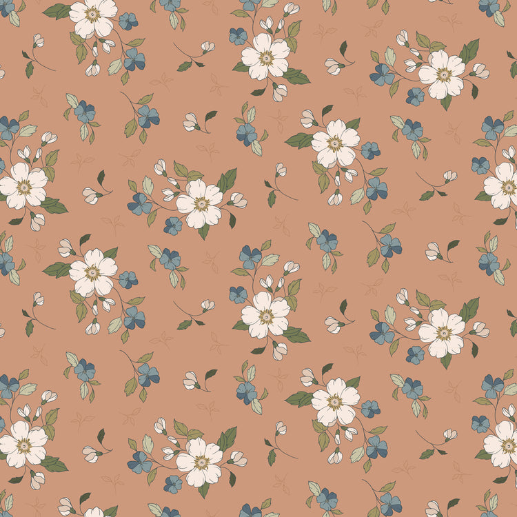 Main Light Clay fabric with cream blossoms, dusty blue flowers, and olive leaves on a warm clay background.
