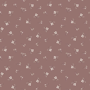 Iris Canyon Rose fabric with ivory flowers, taupe leaves, and delicate buds on a dusty rose background.