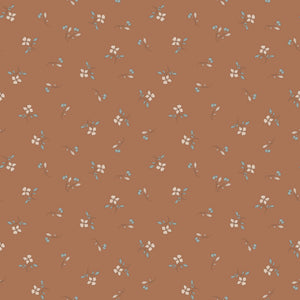 Iris Clay fabric with cream flowers, blue-gray leaves, and tiny buds scattered on warm terracotta.