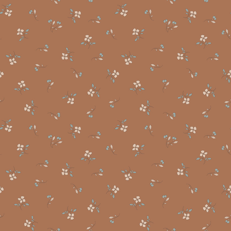 Iris Clay fabric with cream flowers, blue-gray leaves, and tiny buds scattered on warm terracotta.