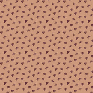 Magnolia Light Clay fabric with small burgundy flower and leaf sprigs scattered on muted peach.