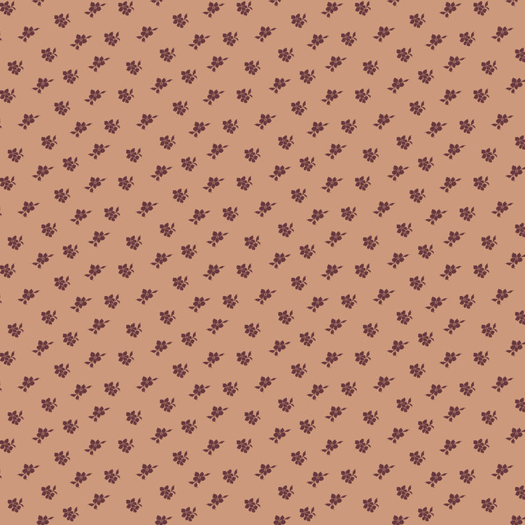 Magnolia Light Clay fabric with small burgundy flower and leaf sprigs scattered on muted peach.