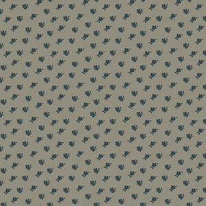 Magnolia Light Gray fabric with small charcoal-blue floral sprigs scattered across a warm gray background.