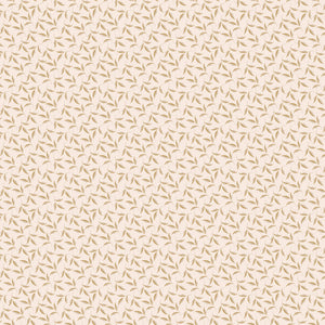 Evergreen Latte fabric with ochre and soft taupe leaves on curling stems across a creamy background.