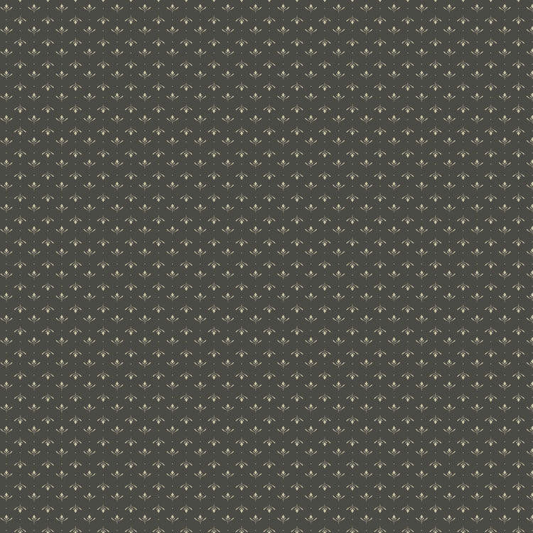 Lottie Gray fabric with tiny cream leaf sprigs and dots in alternating rows on a dark warm gray background.