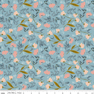 Main Dream floral fabric featuring soft pink and peach flowers, slate-blue foliage, and golden stems on a muted blue background with ruler for scale.