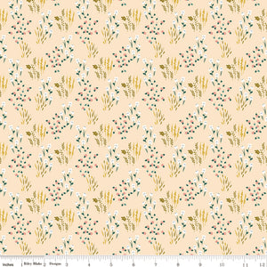 Meadow Blush fabric with white and pink wildflowers, green leaves, and golden sprigs on pale peach with ruler for scale.