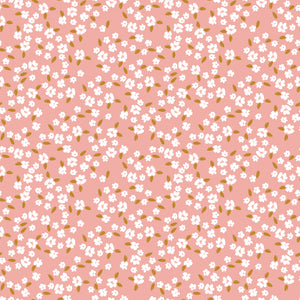 Blossoms Coral fabric with scattered white flowers and golden ochre leaves on a coral-pink background.