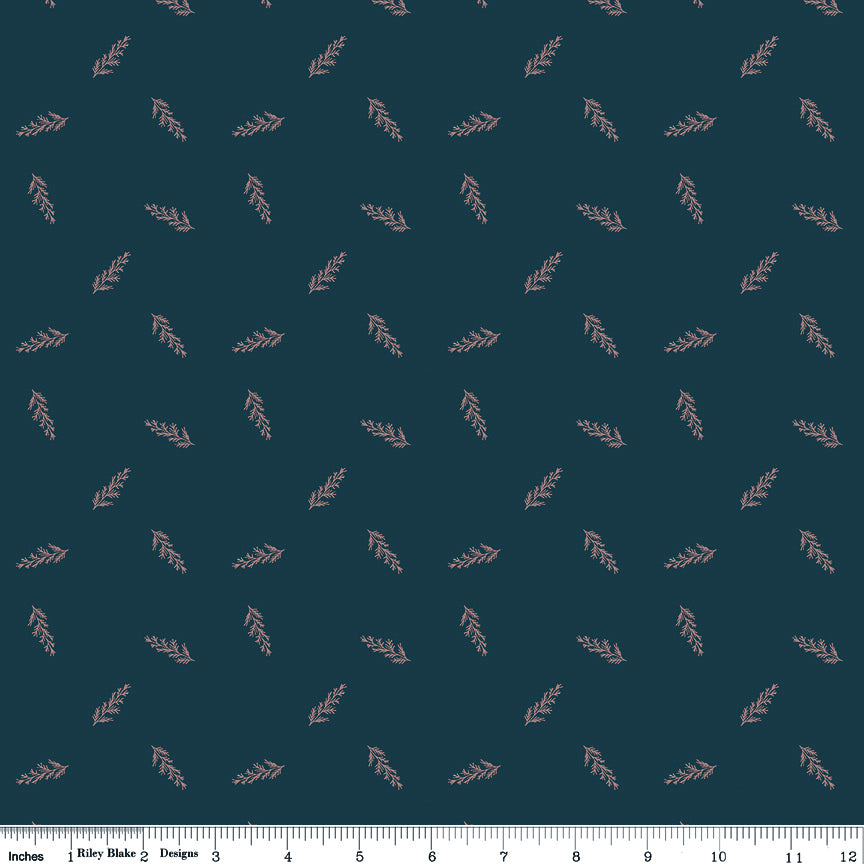 Toss Blue fabric with delicate dusty pink leafy sprigs scattered on a deep teal-blue background with ruler for scale.