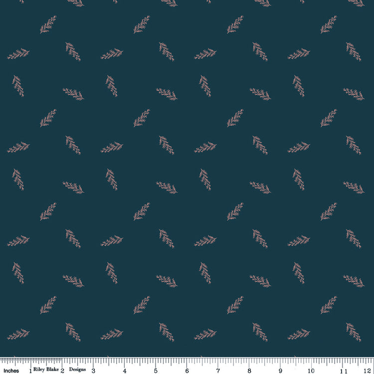 Toss Blue fabric with delicate dusty pink leafy sprigs scattered on a deep teal-blue background with ruler for scale.