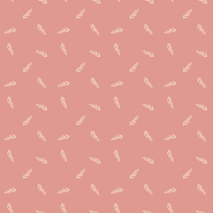 Toss Coral fabric with small cream leafy sprigs tossed across a muted coral-pink background.