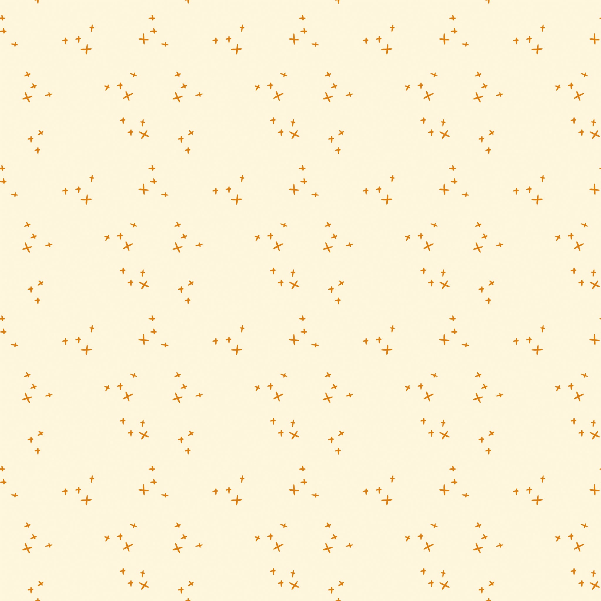 Scatter Cream fabric with small golden-orange crosses arranged in loose clusters on a pale cream background.