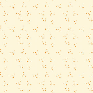 Scatter Cream fabric with small golden-orange crosses arranged in loose clusters on a pale cream background.