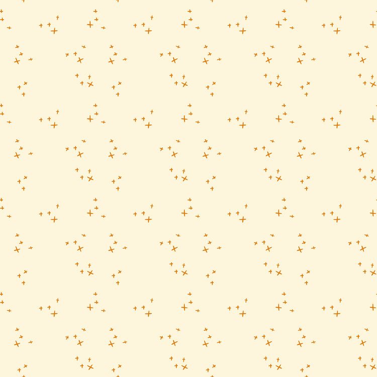 Scatter Cream fabric with small golden-orange crosses arranged in loose clusters on a pale cream background.