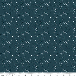 Hearts Blue fabric with tiny ivory hearts scattered in loose clusters on a dark teal-blue background with ruler for scale.