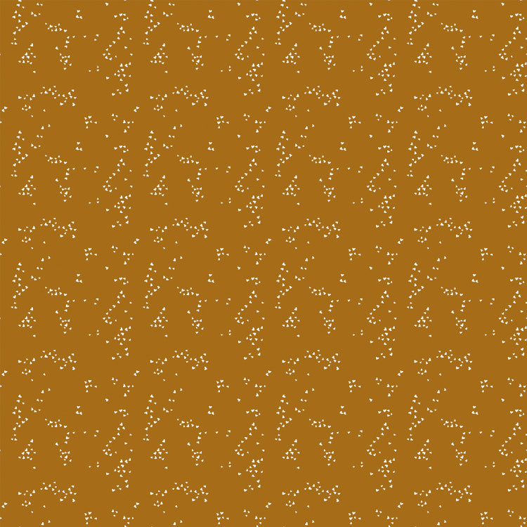 Hearts Butterscotch fabric with small cream hearts in scattered clusters on a warm golden ochre background.