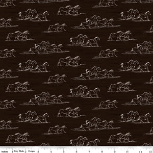 Horse Toile Brown fabric with cream line drawings of running horses on a dark brown background with ruler for scale.