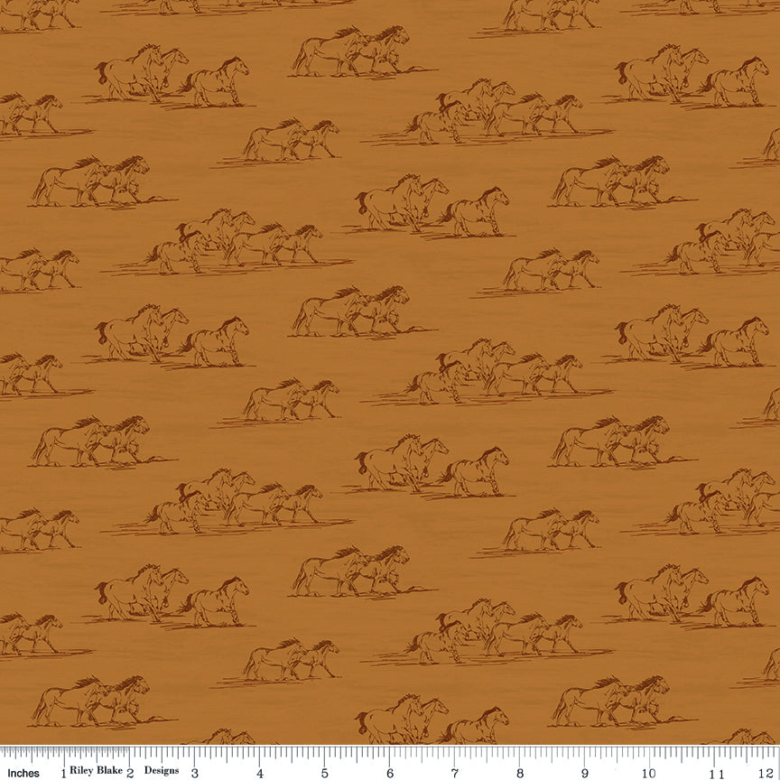 Horse Toile Ochre fabric with dark brown sketches of running horses on a golden ochre background with ruler for scale.