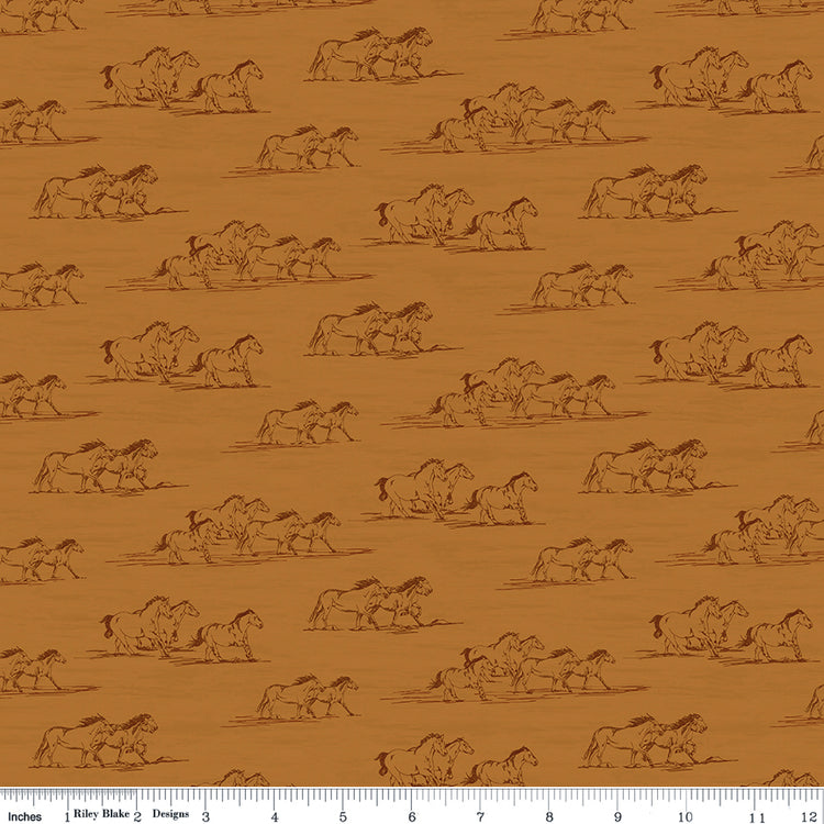 Horse Toile Ochre fabric with dark brown sketches of running horses on a golden ochre background with ruler for scale.