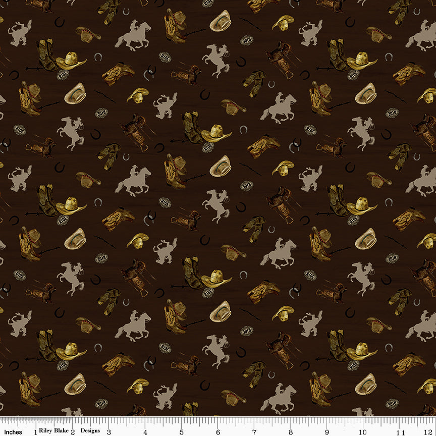 Icon Toss Brown fabric with cowboy hats, boots, saddles, horseshoes, and tan horseback riders on dark brown with ruler for scale.