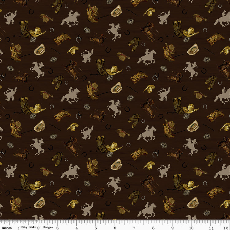 Icon Toss Brown fabric with cowboy hats, boots, saddles, horseshoes, and tan horseback riders on dark brown with ruler for scale.