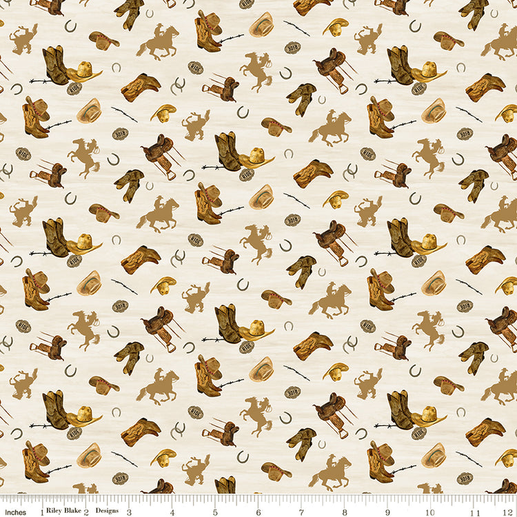 Icon Toss Cream fabric with boots, hats, saddles, horseshoes, and golden horseback riders on cream with ruler for scale.
