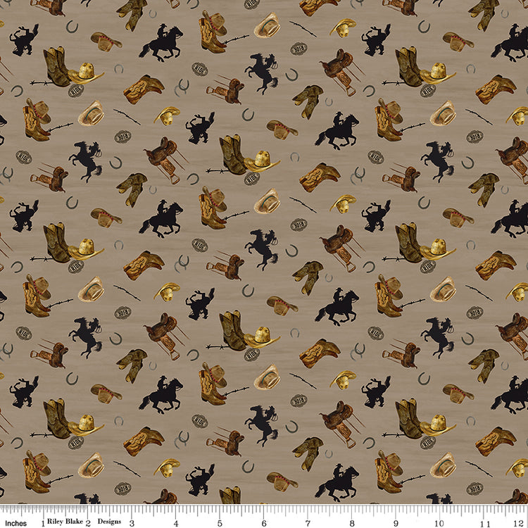 Icon Toss Tan fabric with brown boots, hats, saddles, horseshoes, and black horseback riders on tan with ruler for scale.