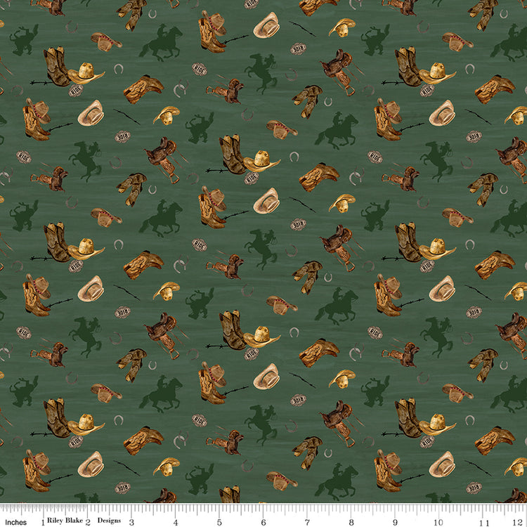Icon Toss Teal fabric with cowboy boots, hats, saddles, horseshoes, and dark green horseback riders on muted teal with ruler for scale.
